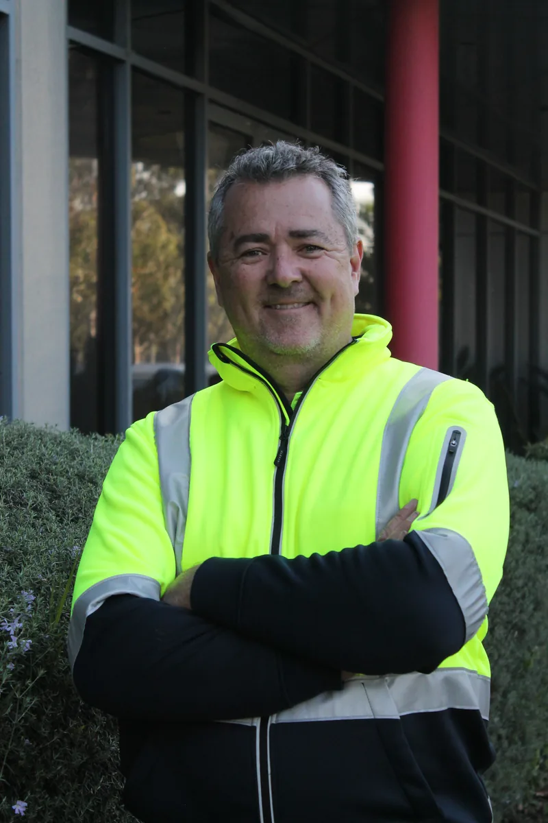 Chris Parker, Director of COMSTRA Mowing, at the company depot