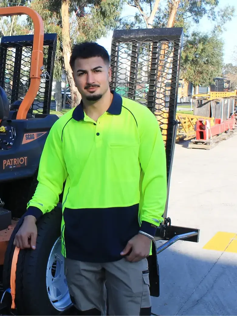 Joel Grech, gardener at COMSTRA Mowing, with the zero-turn mower loaded for transport