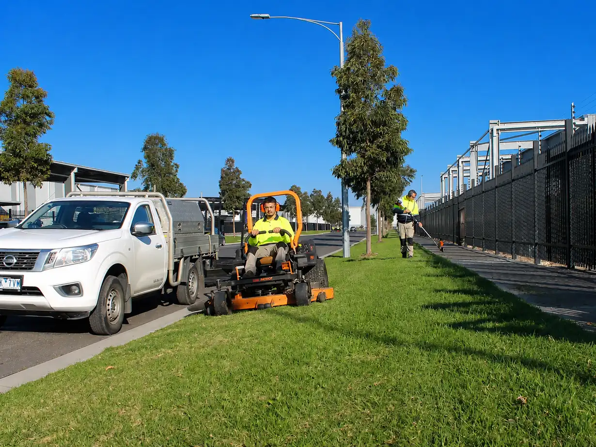 COMSTRA Mowing crew mowing and edging a nature strip on a Tullamarine street