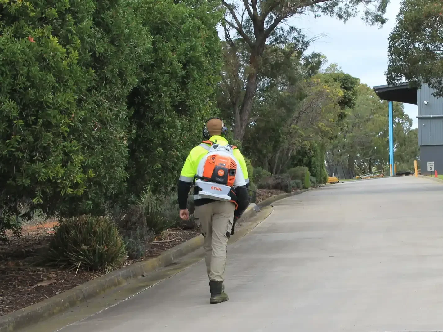 COMSTRA Mowing gardener leaf blowing a driveway at an industrial site in Williamstown